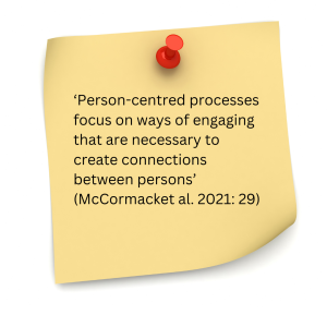 The image shows a yellow sticky note pinned with a red pushpin. The note contains a typed quote that reads: "Person-centred processes focus on ways of engaging that are necessary to create connections between persons" (McCormack et al. 2021: 29).